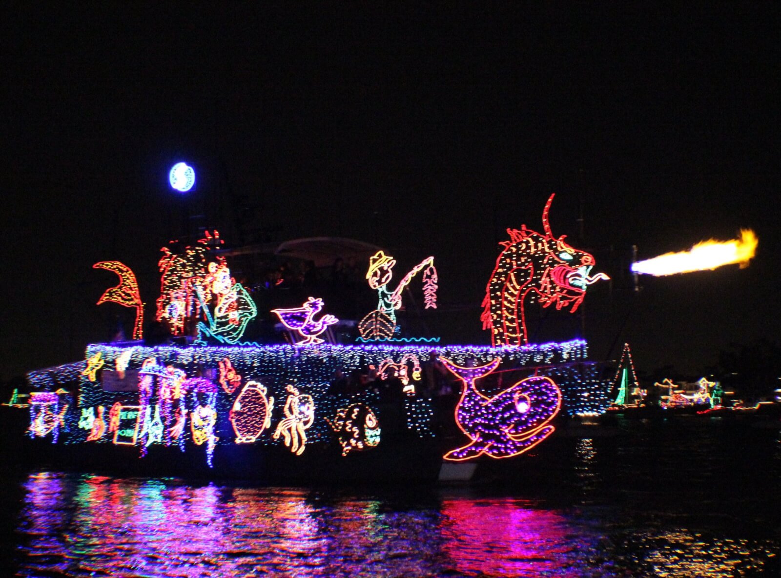 boat decorated in lights