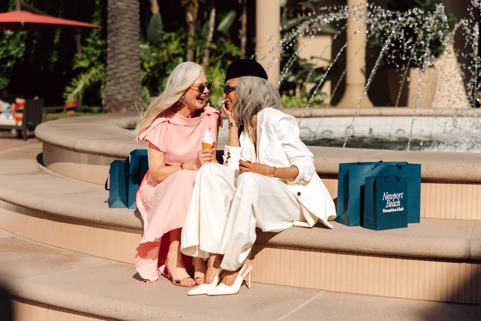 2 women sitting having ice cream