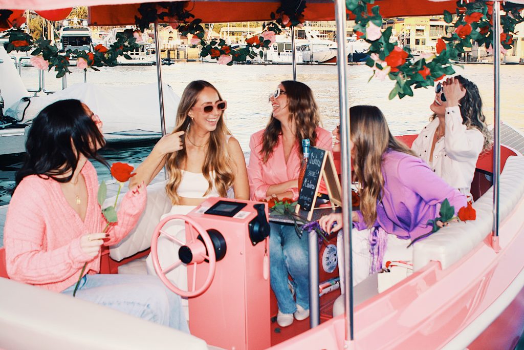 women on a duffy boat