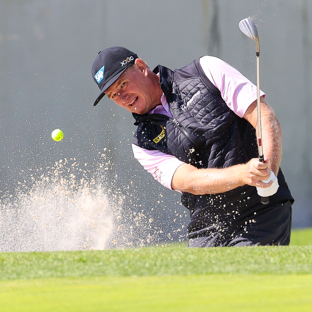 Golfer hitting a golf ball