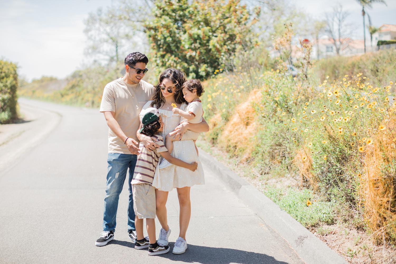 dad, mom and 2 kids walking