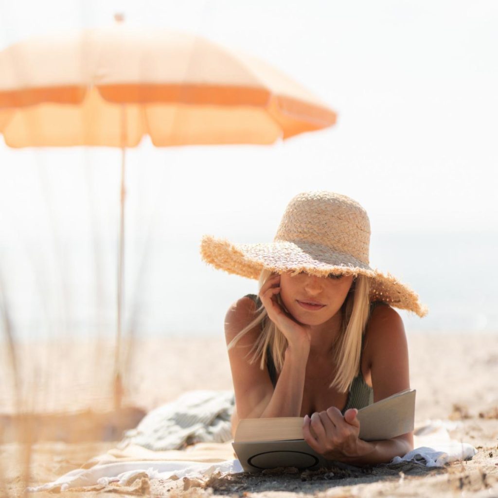 woman reading on beach