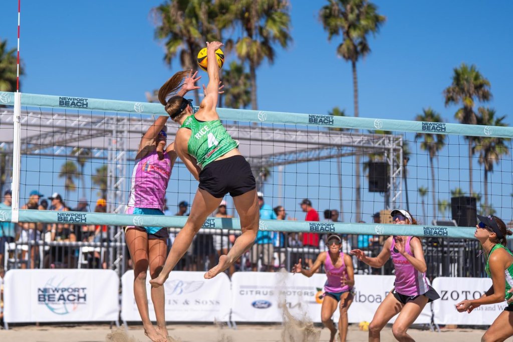 woman playing volleyball on the beach