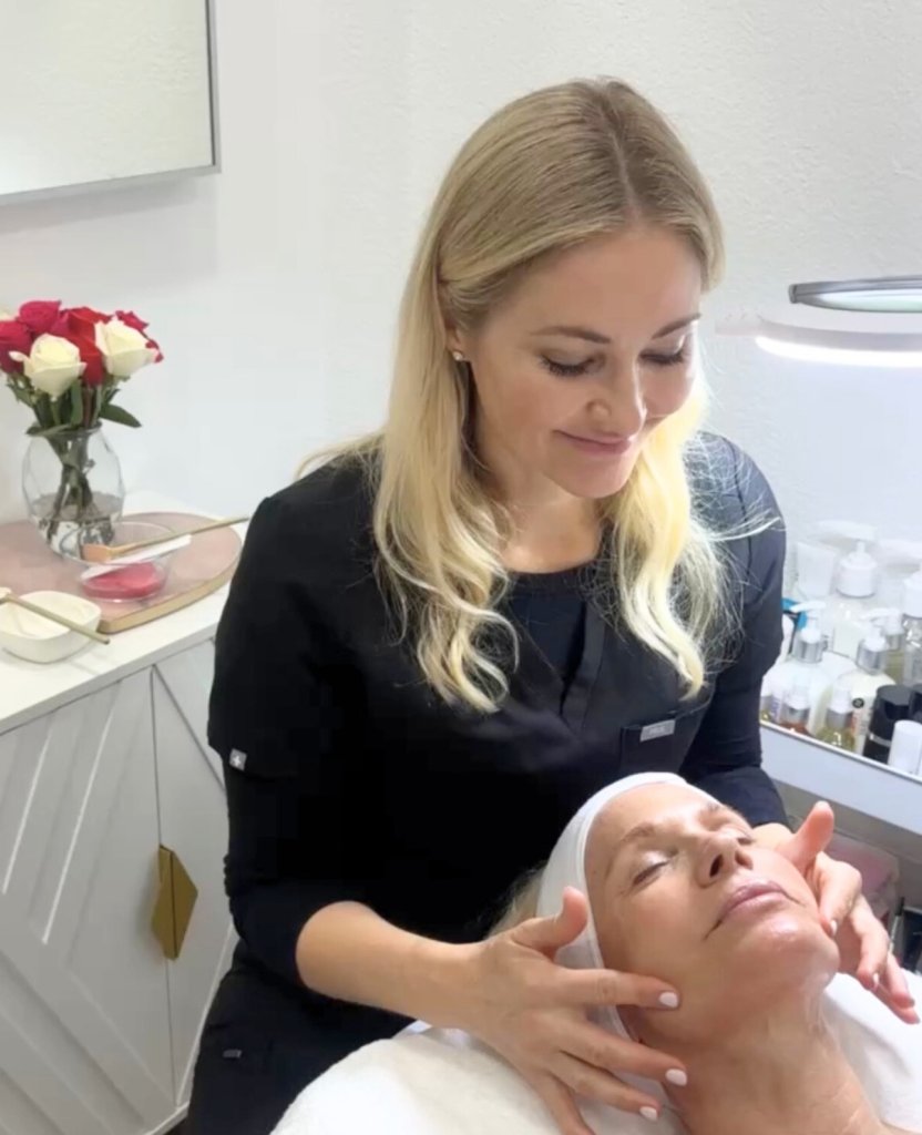 a woman giving a facial