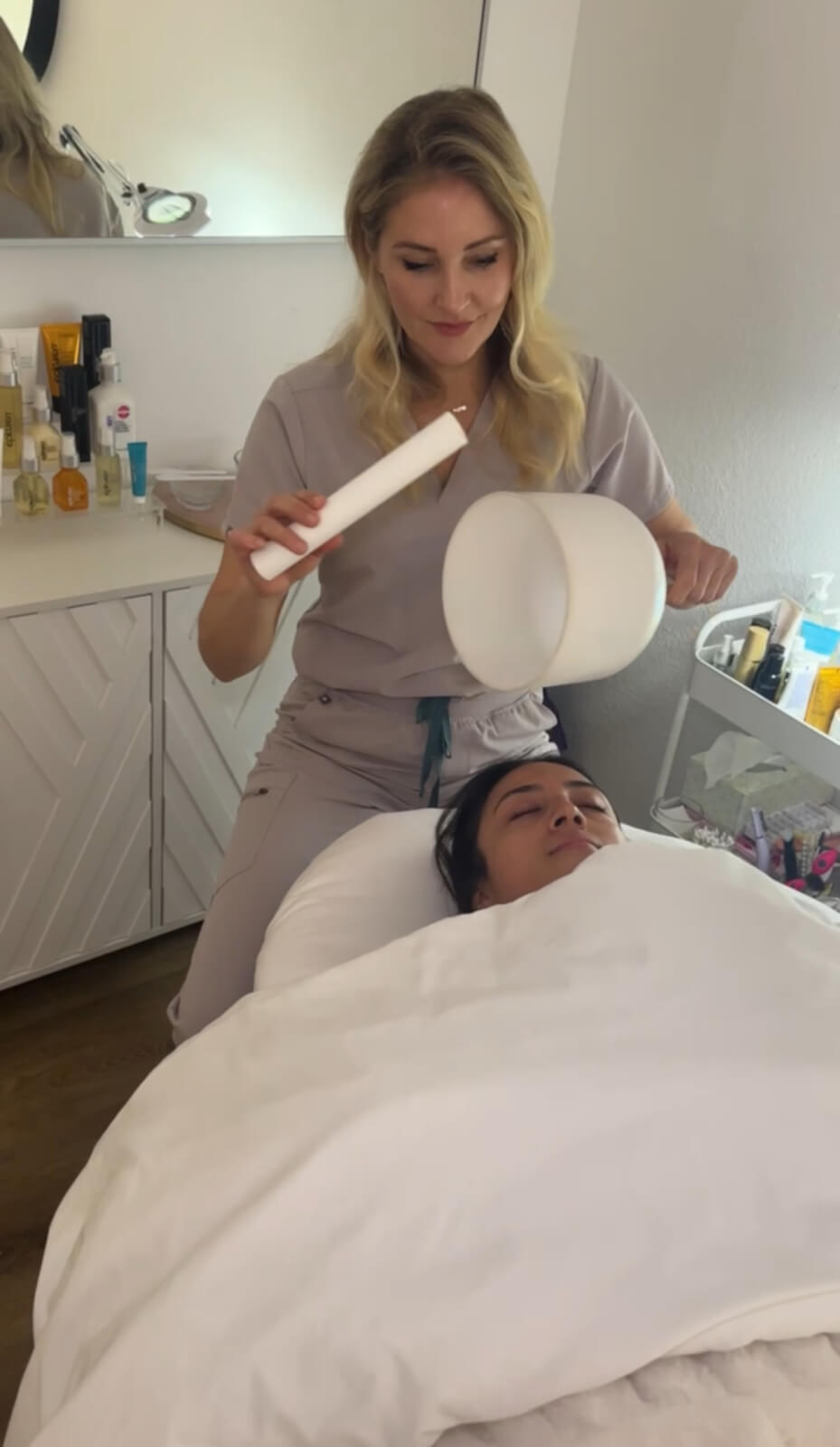 a woman giving a facial