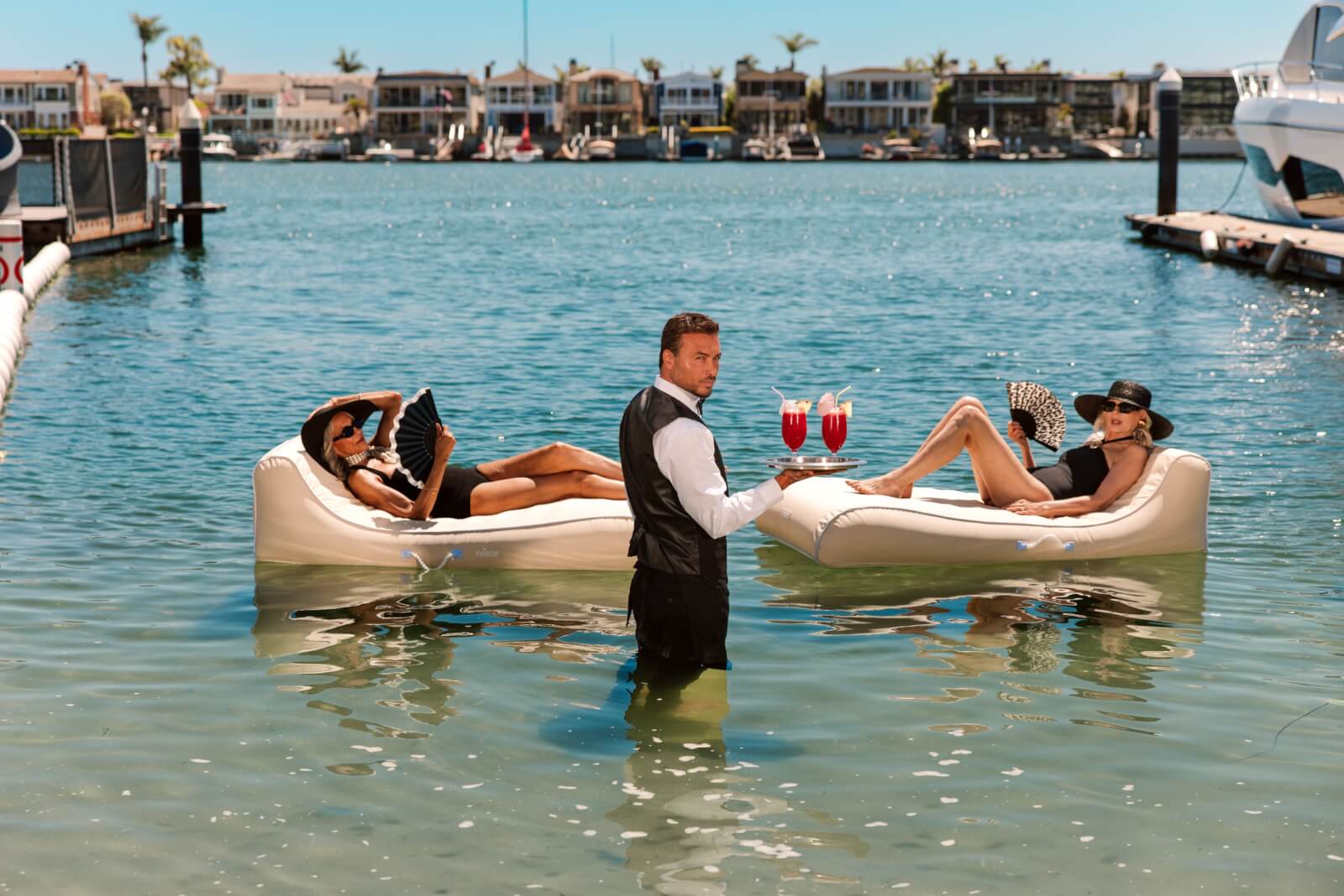 2 ladies on a floatie on the water