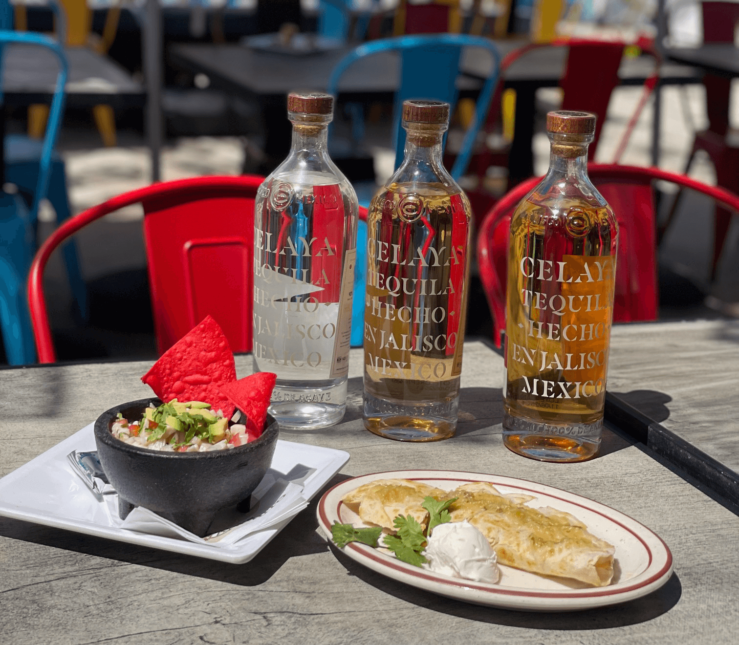 tequila bottles and mexican food on a plate