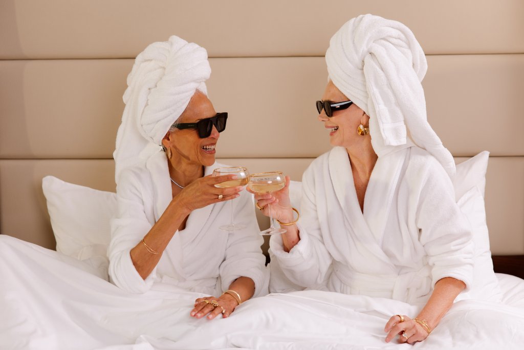 2 women in bathrobes