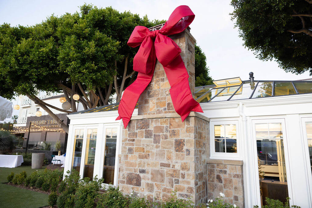 outside of a building with a red bow