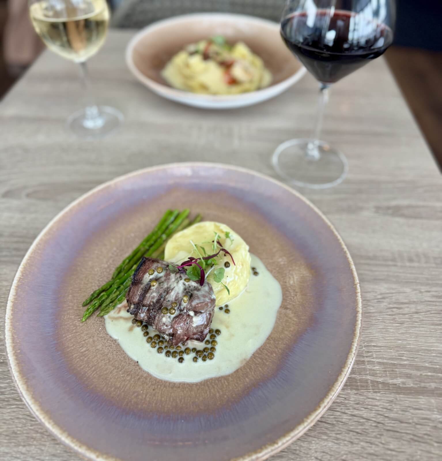 2 plated dishes on a table