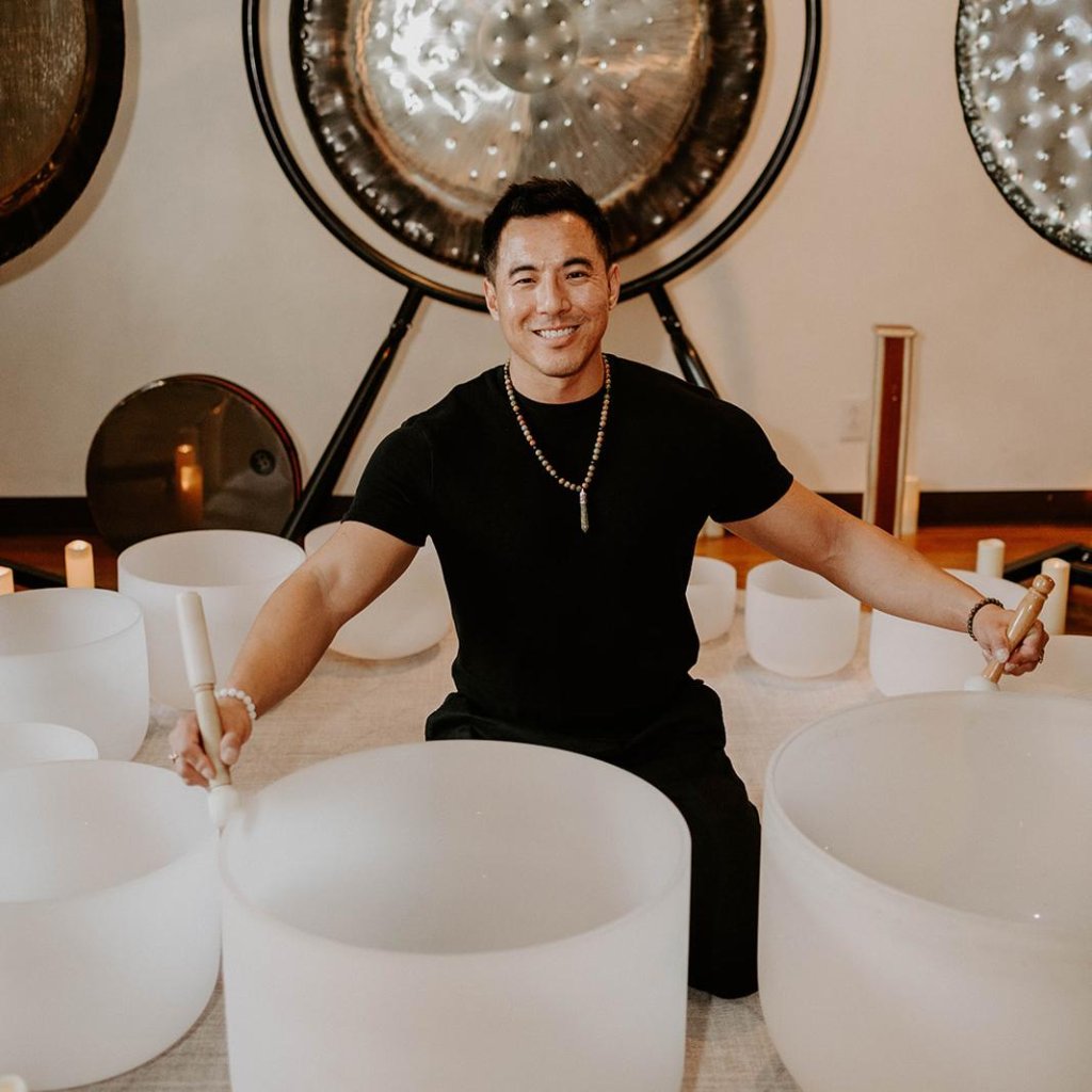 a man sitting down smiling