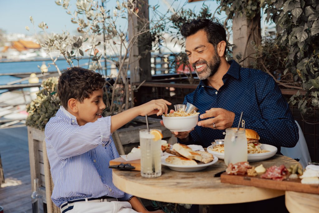 father and son eating