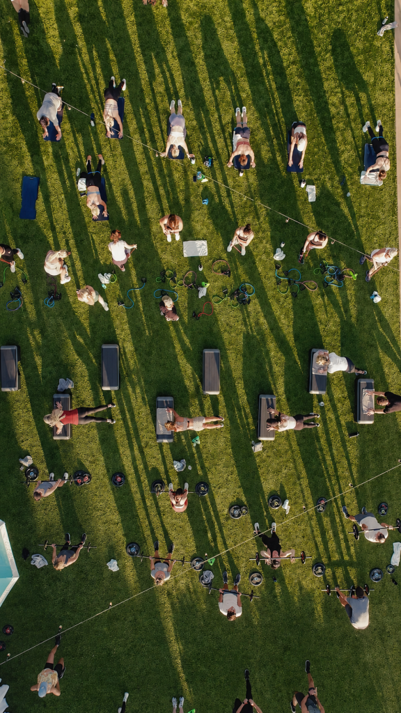 Aerial view of people exercising on a lawn