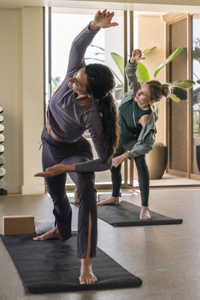 Two women doing yoga