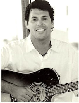 man holding guitar