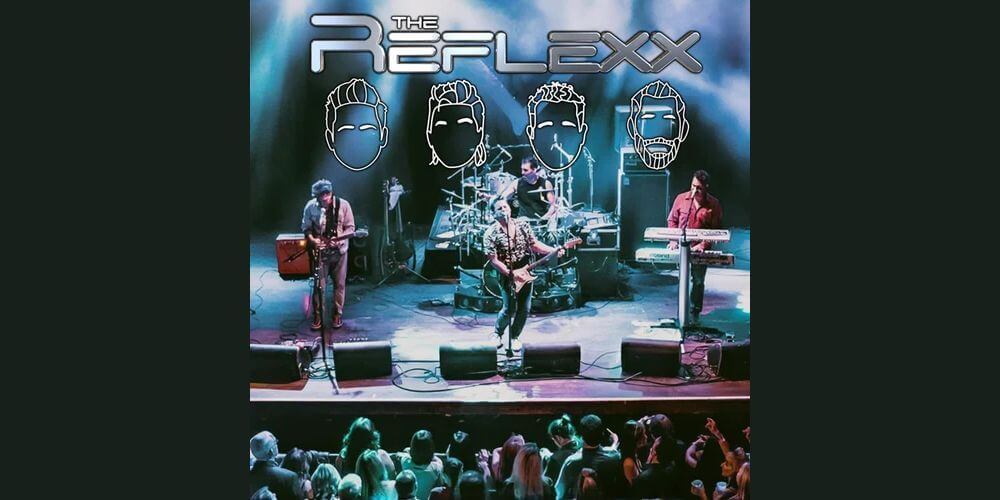 Band playing guitars on a stage