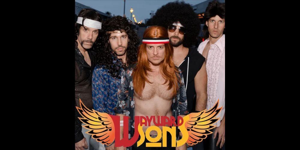 Five men posing with band logo beneath them