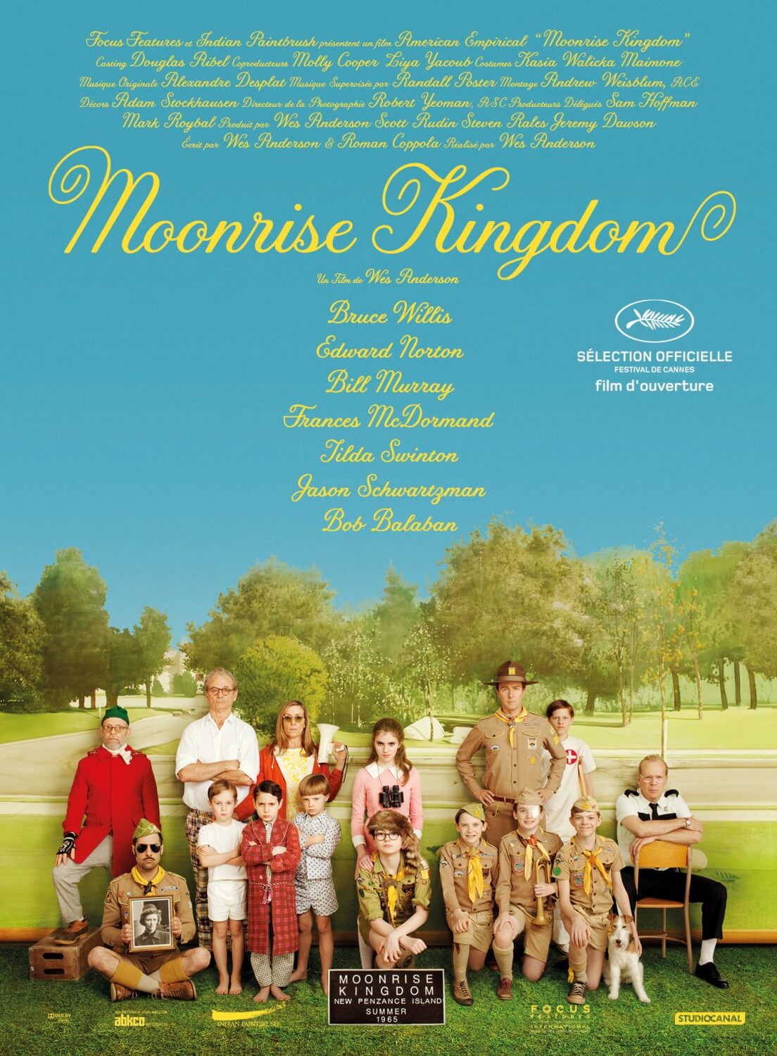 Movie poster of several people standing in grass field with blue sky